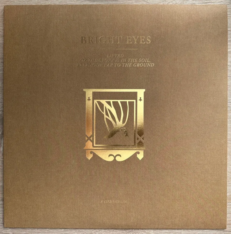 Bright Eyes - Lifted Or The Story Is In The Soil, Keep Your Ear To The Ground (A Companion) (12", EP, Ltd, Gol) (Mint (M))